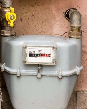 A gas meter with the words " 1 0 2 5 " on it.